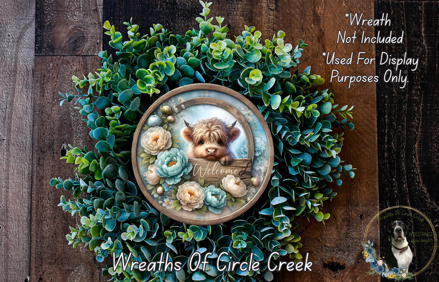 a wreath with a small cow's head and a wooden sign that says "Welcome" in the center. The wreath is surrounded by various green plants and flowers, creating a festive and welcoming atmosphere.