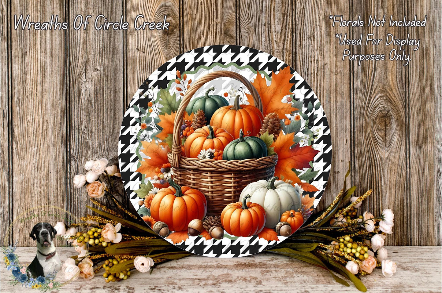 A decorative wreath made of a basket filled with autumn-themed pumpkins and leaves, placed on a wooden surface.