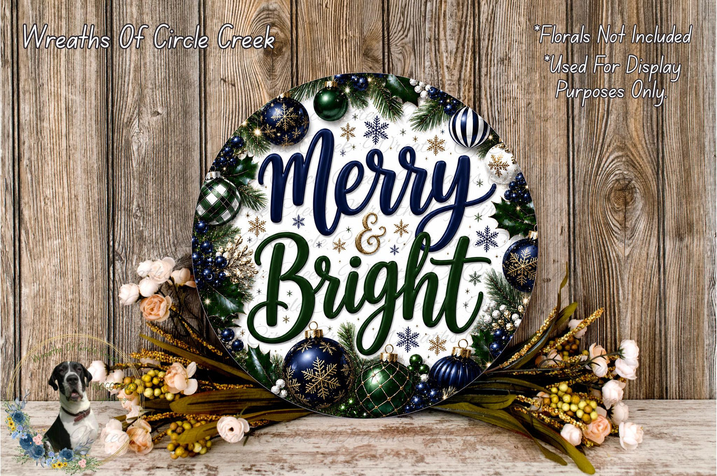 A festive wreath with the text "Merry & Bright" displayed on it, surrounded by various holiday decorations such as ornaments, flowers, and pine branches. The wreath is placed on a wooden surface, and there is a small dog in the background.