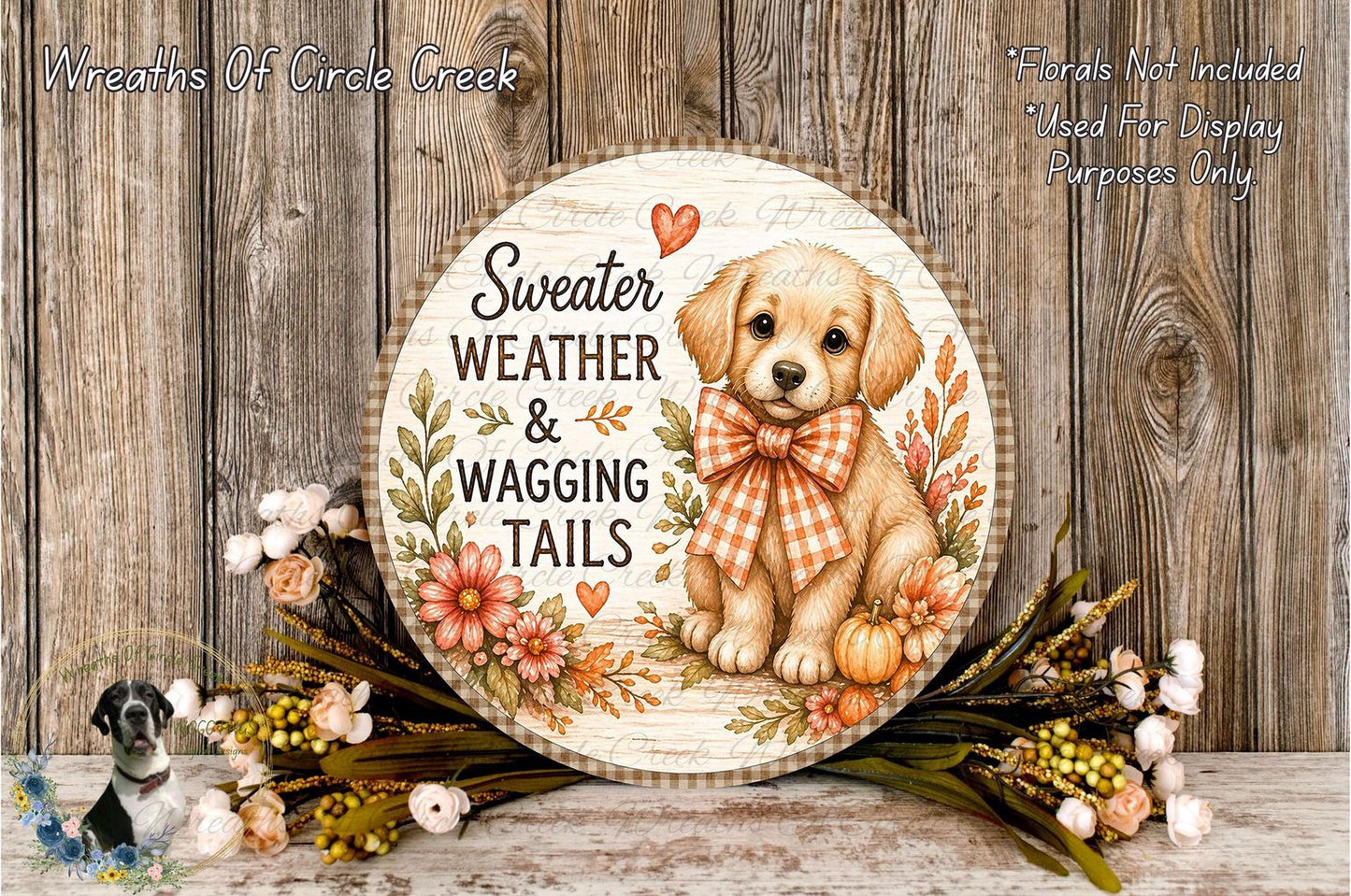 A round wooden sign with a dog illustration and the text "Sweater Weather & Wagging Tails" is surrounded by a wreath of flowers and autumn foliage.