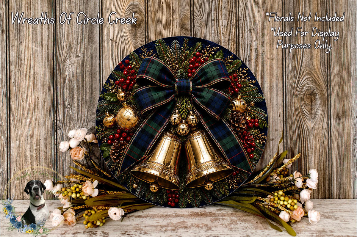 A decorative wreath with a plaid ribbon, bells, and various ornaments, including berries and flowers, displayed on a wooden surface.