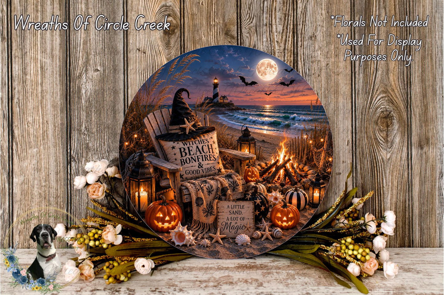 A Halloween-themed wreath featuring a lighthouse, beach bonfires, pumpkins, and a full moon, set against a backdrop of a beach at night.