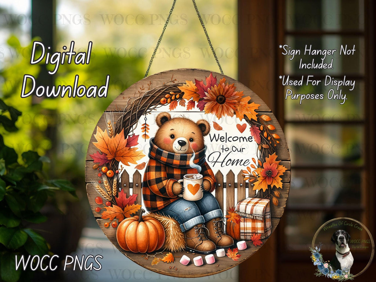 The image is a digital download of a round wooden sign featuring a bear holding a mug and surrounded by autumn decorations such as leaves, pumpkins, and flowers.
