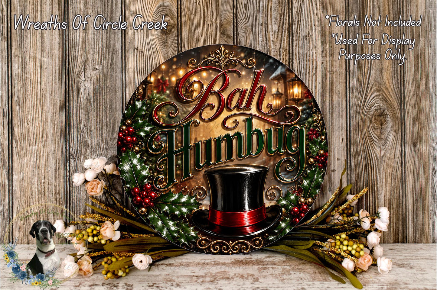a decorative wreath with the text "Bah Humbug" and a top hat, surrounded by flowers and greenery.