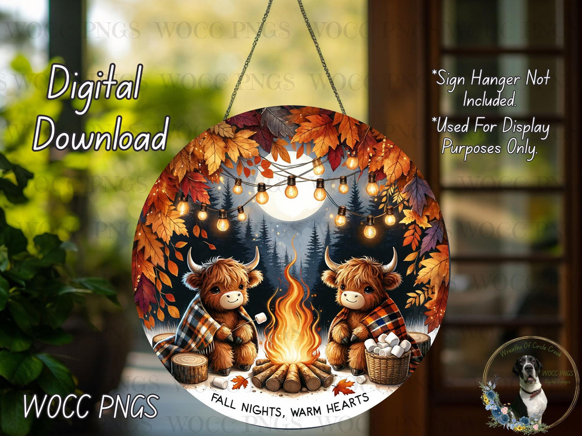 A digital download of a round sign featuring two cartoon cows sitting by a campfire, surrounded by autumn leaves and a full moon.