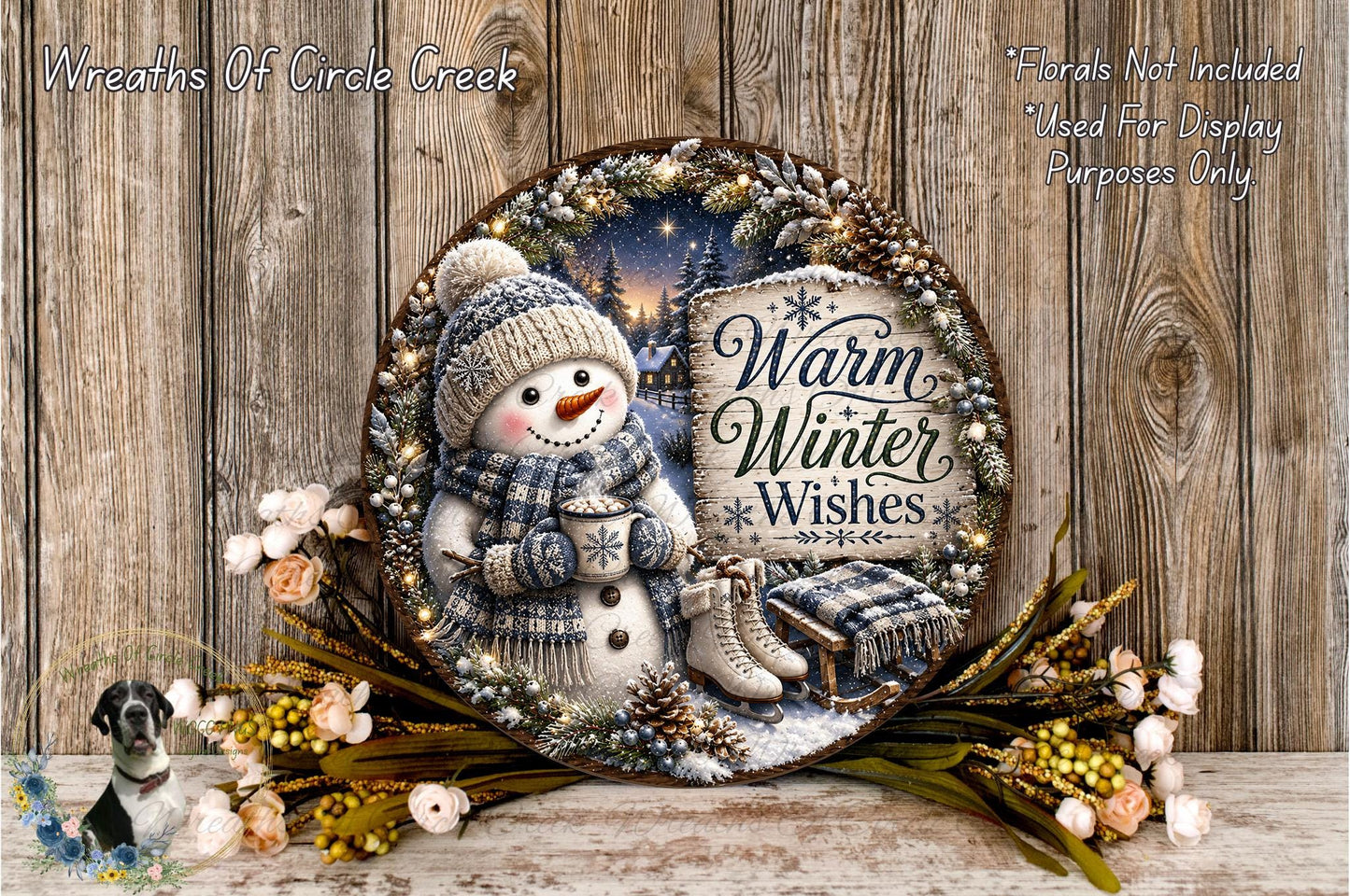 A snowman wearing a scarf and hat, holding a cup of hot chocolate, surrounded by a wreath of flowers and pine cones, with the text "Warm Winter Wishes" displayed on the wreath.
