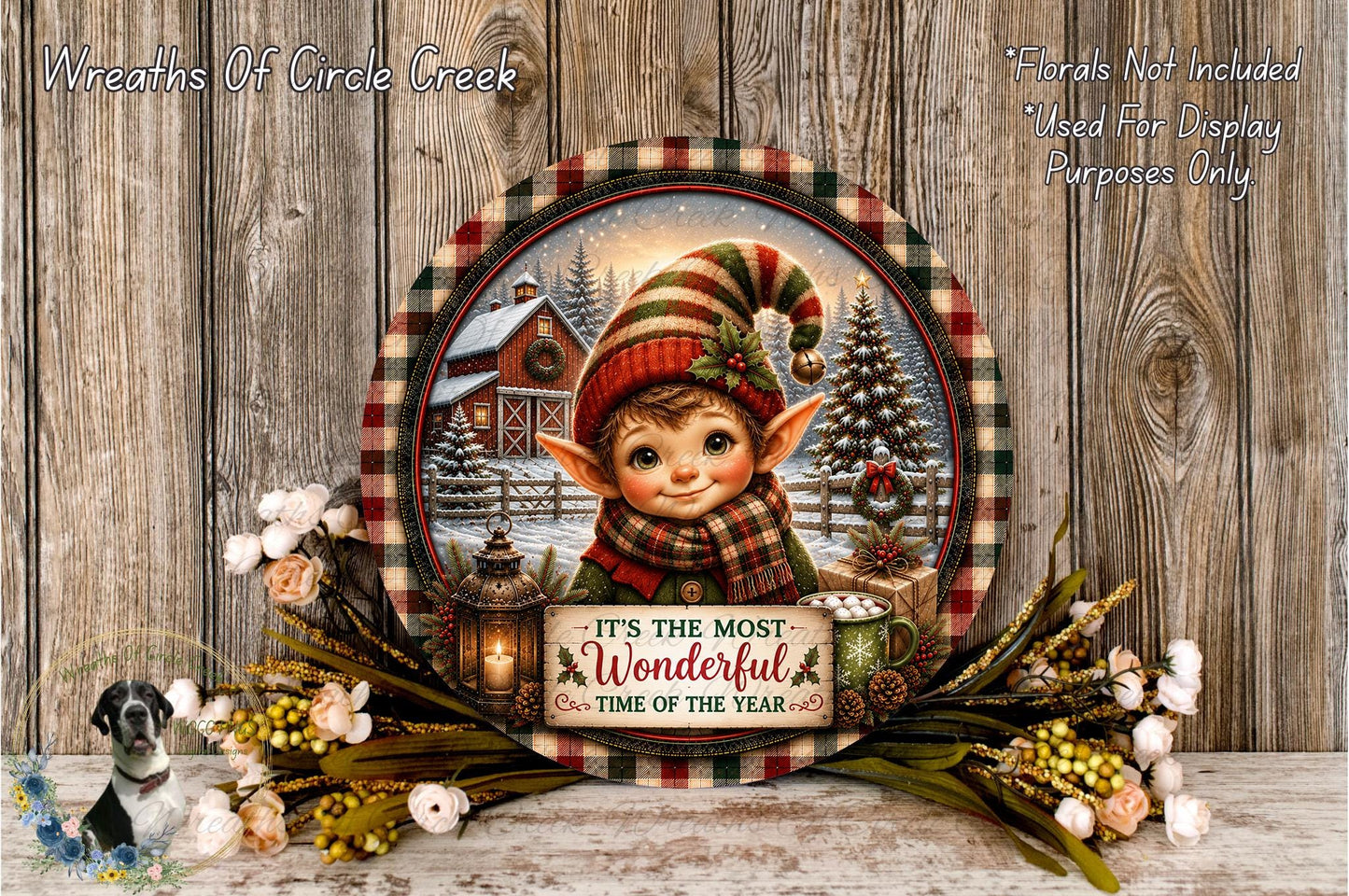 A festive wreath with a smiling elf, surrounded by flowers and a sign that reads "It's the most Wonderful Time of the Year".
