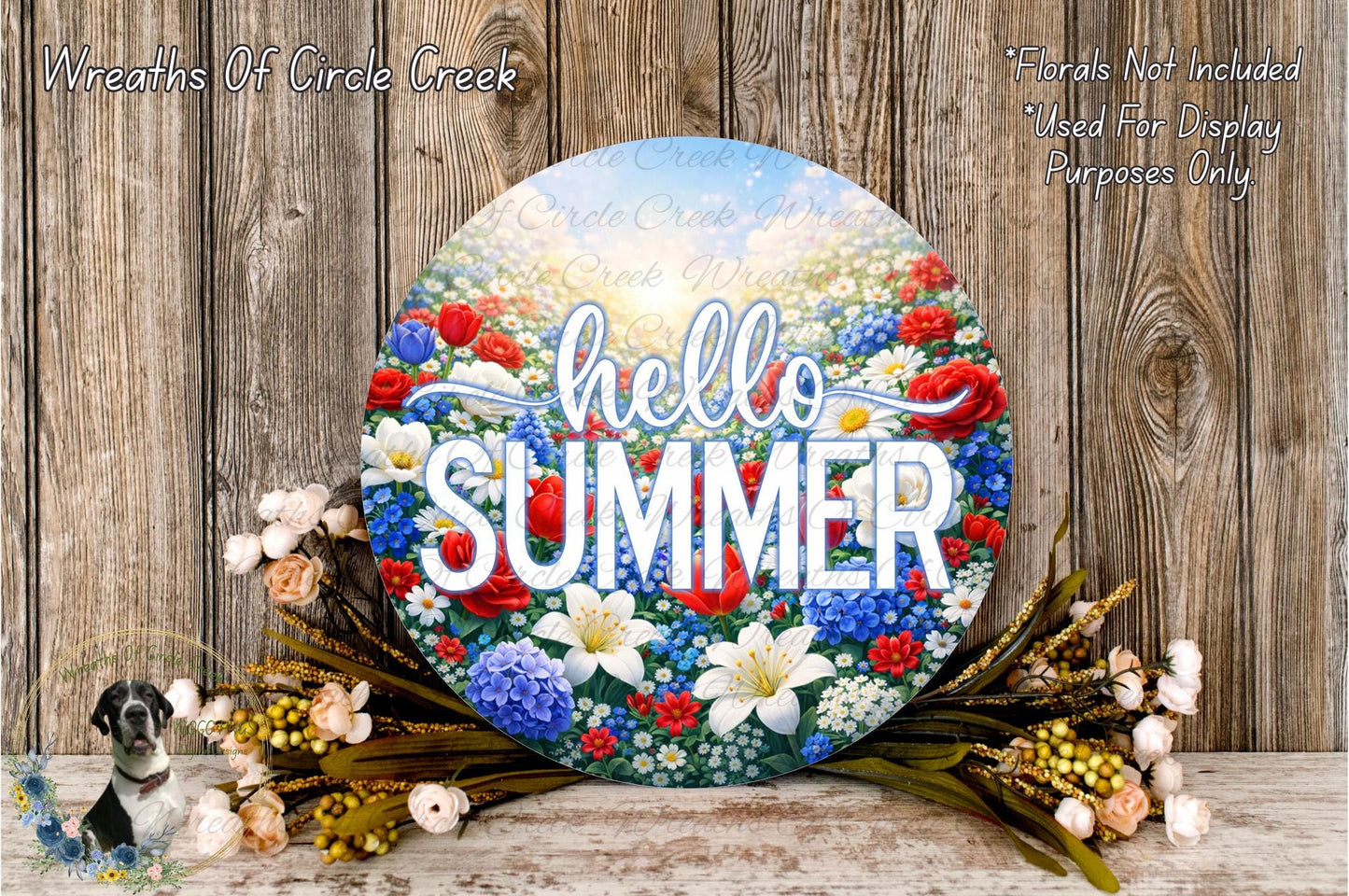 A circular sign with the word "Hello Summer" written on it, surrounded by a colorful floral arrangement and some flowers.