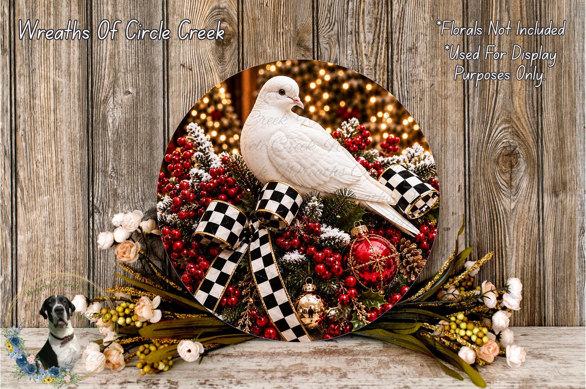 A white bird perches on a wreath adorned with red berries, gold ornaments, and a checkered ribbon, set against a backdrop of twinkling lights.
