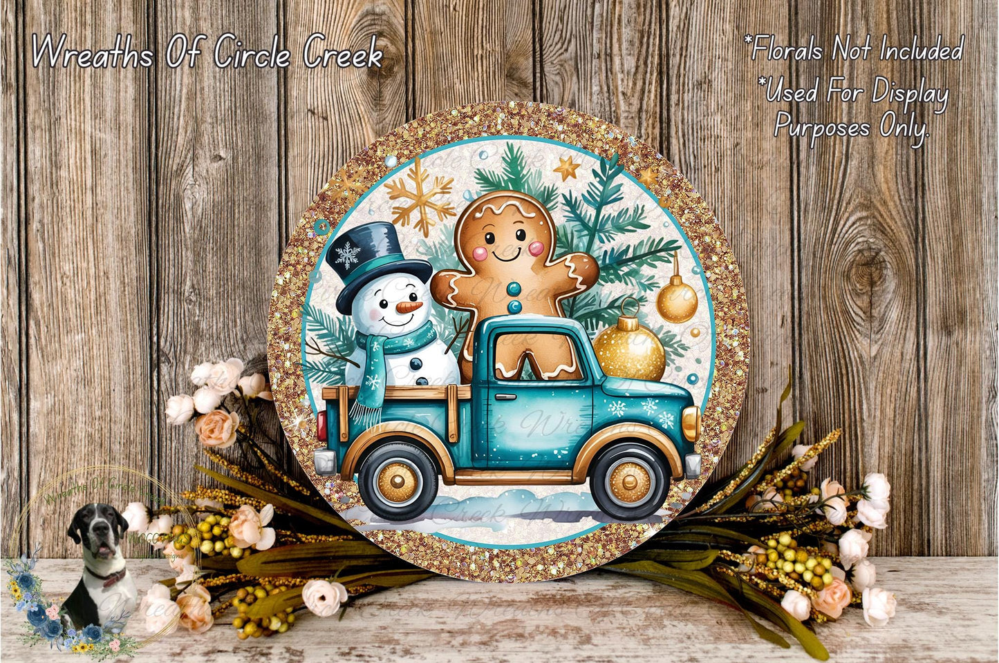 A round decorative plate featuring a snowman and a gingerbread man on a blue truck, surrounded by a wreath of flowers and greenery.