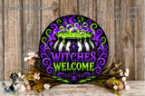 A decorative sign with the text "WITCHES WELCOME" in a colorful, whimsical style, surrounded by flowers and a cauldron.
