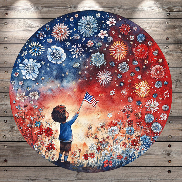 A young boy is standing in a field of flowers, holding an American flag and gazing up at the night sky filled with colorful fireworks.