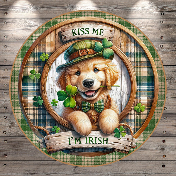 A golden retriever dog wearing a green hat and holding a clover, surrounded by shamrocks, with the text "KISS ME I'M IRISH" above and below the dog.