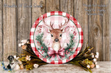 a decorative plate with a deer head and a bow, surrounded by a floral arrangement and a wooden background.