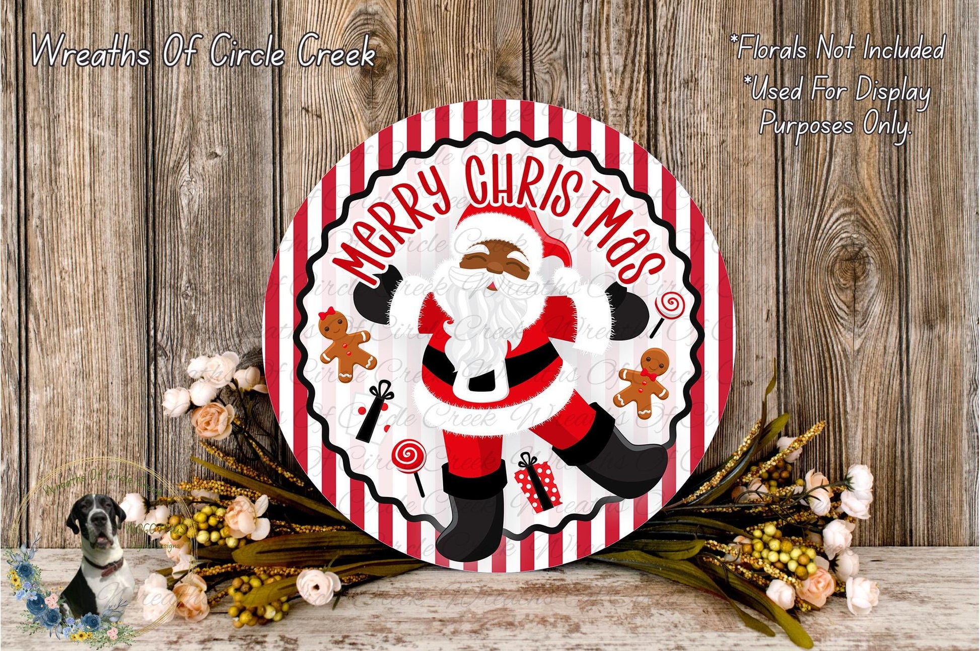 A festive Christmas wreath with a Santa Claus figure, surrounded by flowers and other holiday decorations.