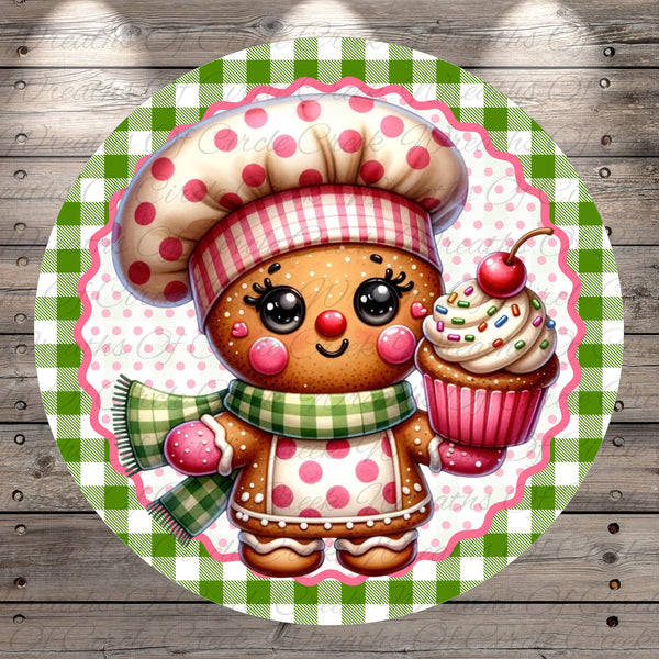 A whimsical illustration of a gingerbread man wearing a chef's hat and holding a cupcake, set against a green and white checkered background.