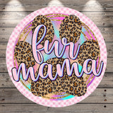 A round graphic with a pink border and leopard print pattern. The text "fur mama" is written in a cursive font.