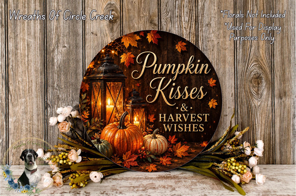 A decorative wreath with a pumpkin and lanterns, surrounded by fall foliage and flowers, with the text "Pumpkin Kisses & Harvest Wishes" displayed on it.