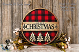 A round wooden sign with a red and black plaid pattern, displaying the text "Merry Christmas" in bold letters. The sign is surrounded by a wreath of flowers and greenery, creating a festive holiday display.