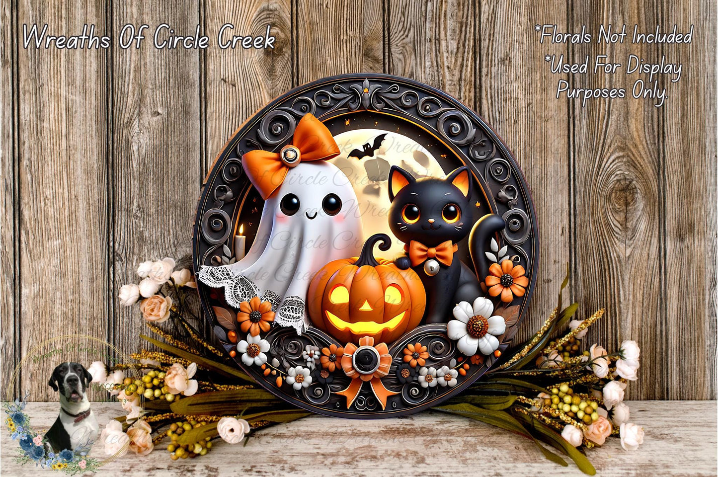 A Halloween-themed wreath featuring a ghost, a cat, a pumpkin, and flowers, with a wooden background.