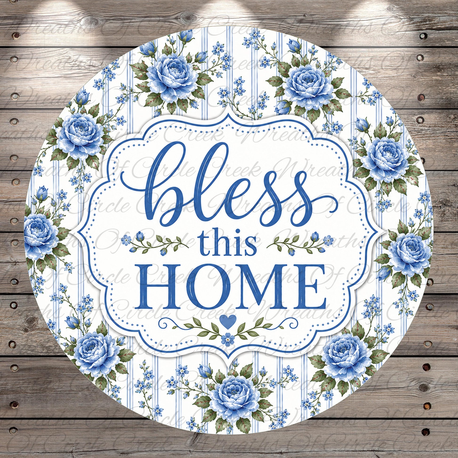 A round sign with a floral border and the text "bless this home" in blue and white.