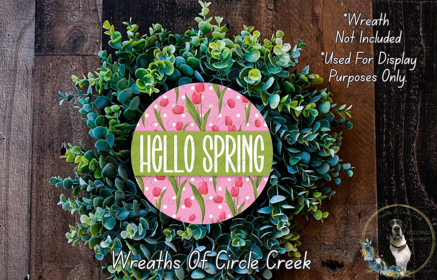 A wreath made of green leaves and pink flowers, with the text "Hello Spring" displayed prominently in the center.
