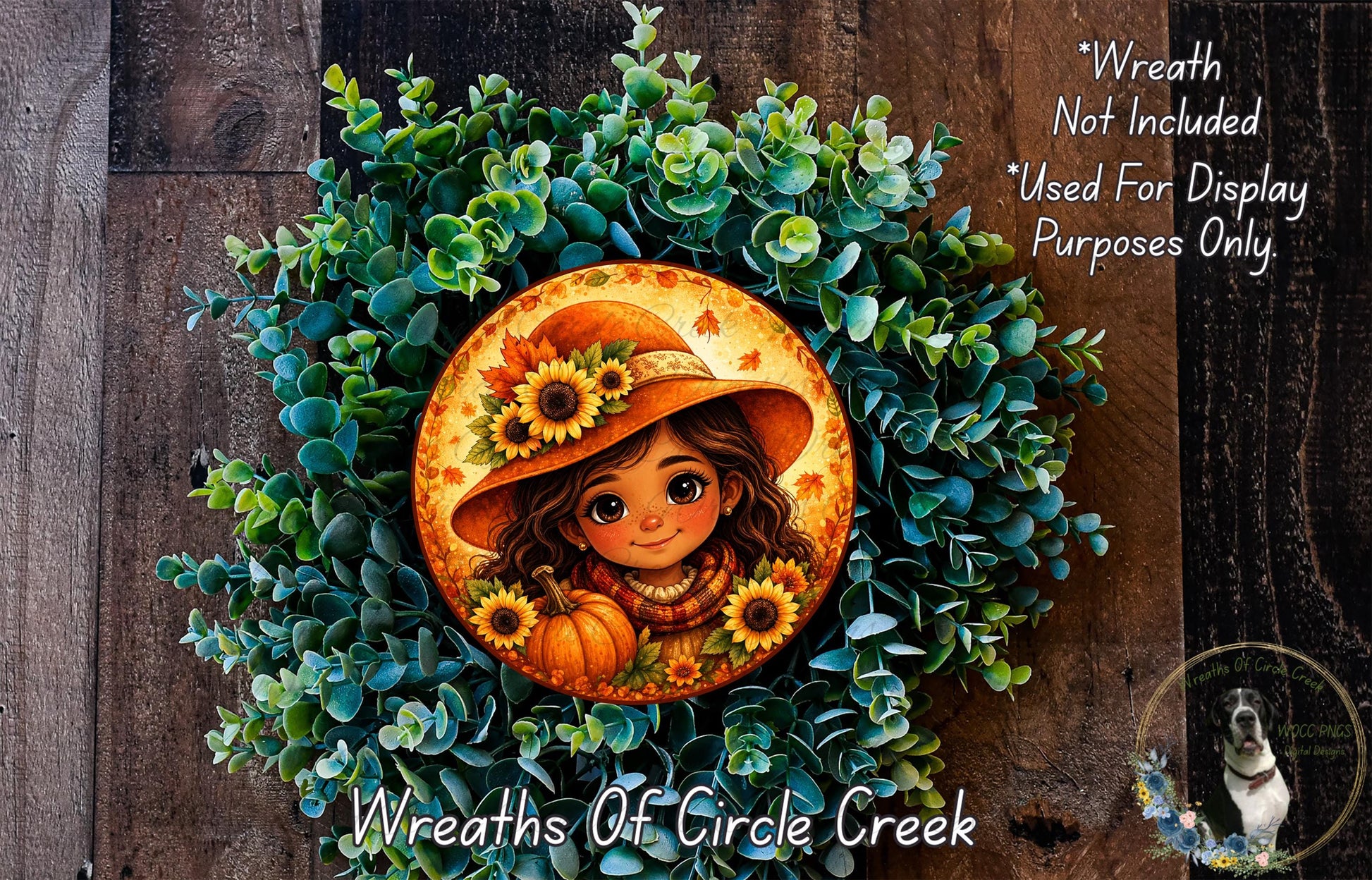A wreath made of green leaves and flowers, with a circular design featuring a smiling girl wearing a hat and holding a pumpkin.