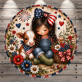 A young girl in patriotic attire sits with a cow, surrounded by flowers and a basket of flowers, against a wooden background with fireworks and stars.