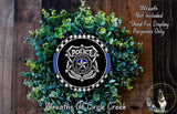 a wreath made of green leaves and a police badge, with the text "Wreath Not Included * Used For Display Purposes Only" and "Wreaths Of Circle Creek" written above it.