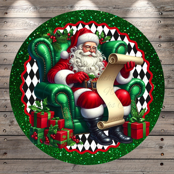 Santa Claus sitting in a green armchair, holding a scroll and surrounded by presents and holly leaves, against a backdrop of a glittery border with a black and white diamond pattern.
