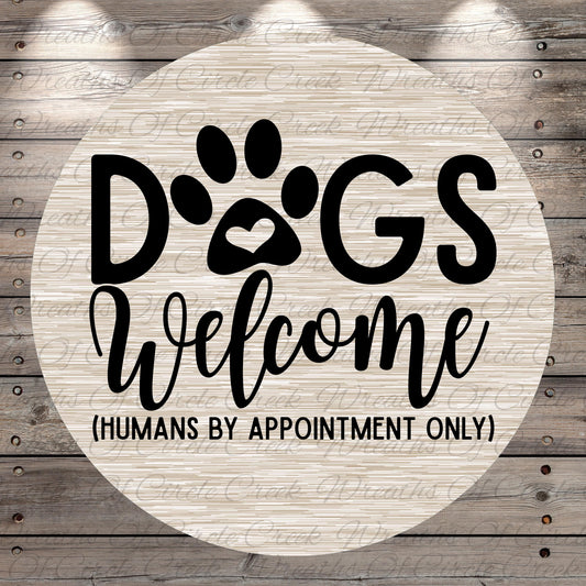 a circular sign with the text "Dogs Welcome (Humans by Appointment Only)" written on it.