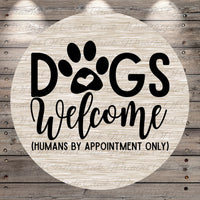 a circular sign with the text "Dogs Welcome (Humans by Appointment Only)" written on it.
