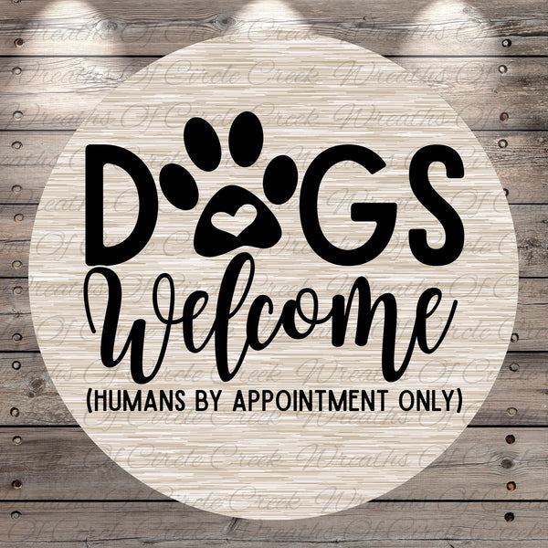 a circular sign with the text "Dogs Welcome (Humans by Appointment Only)" written on it.
