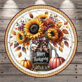 A circular arrangement featuring a jar filled with sunflowers, autumn leaves, and a pumpkin, with the text "Happy Thanksgiving" displayed on the jar.