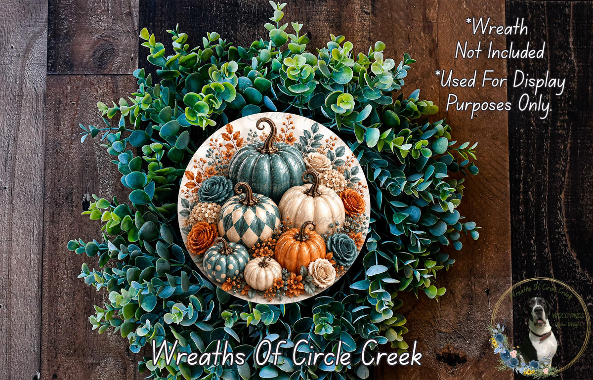 a wreath made of various autumn-themed elements, including pumpkins, gourds, and greenery. The wreath is displayed on a wooden surface, and there is a small dog in the bottom right corner of the image.