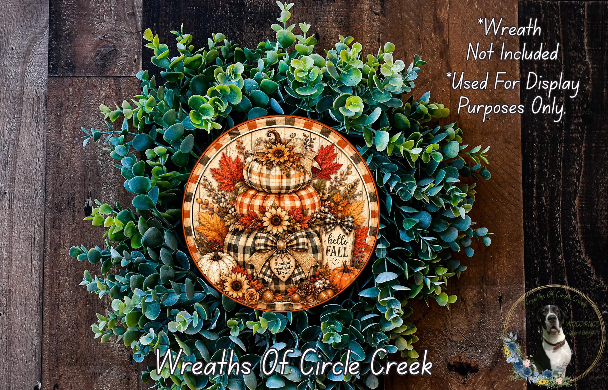 a wreath made of various fall-themed elements, including pumpkins, leaves, and flowers, set against a wooden background.