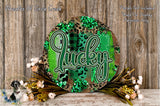 a round sign with the word "Lucky" written on it, surrounded by a floral arrangement and placed on a wooden surface.