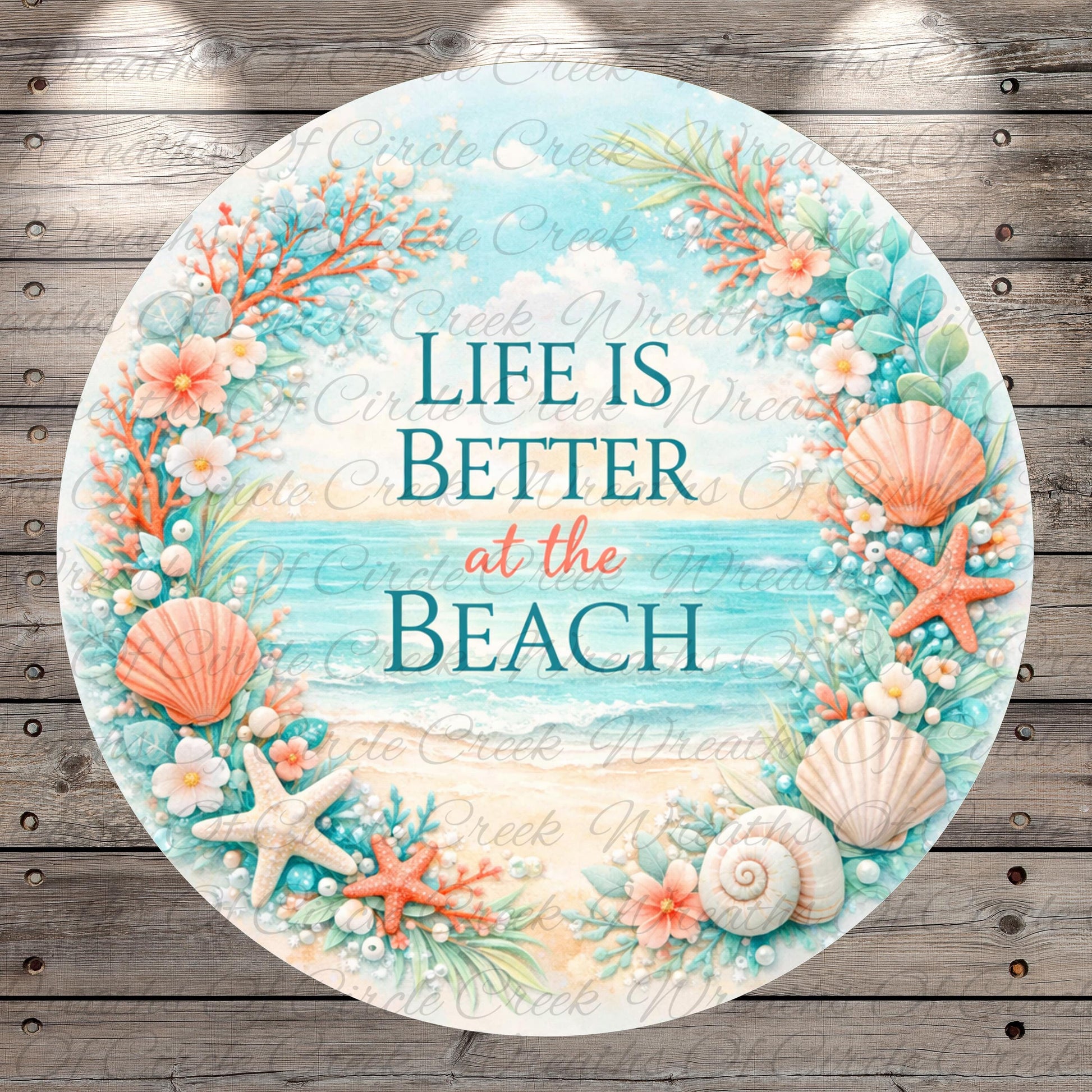 a circular design with a beach-themed border, surrounded by various seashells, starfish, and flowers. The text "Life is better at the beach" is displayed in the center of the design.