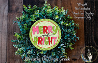 a wreath made of green leaves and a circular sign with the text "MERRY and BRIGHT" in a festive style.