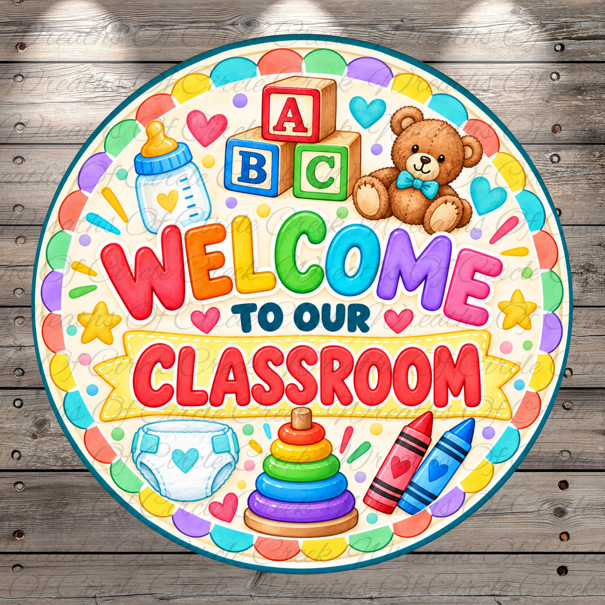 The image is a colorful welcome sign for a classroom, featuring various children's items such as a teddy bear, baby bottle, crayons, and a stack of rings.