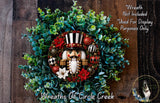 A wreath made of green leaves and red and white ornaments, featuring a nutcracker figure as the central decoration.