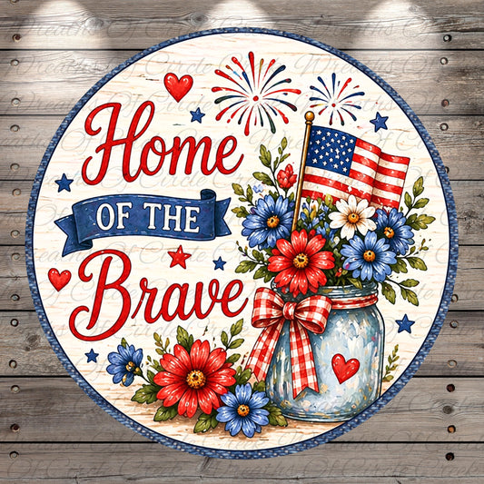 The image is a patriotic design featuring a mason jar filled with flowers, surrounded by a banner that reads "Home of the Brave" and an American flag. The design is set against a wooden background with a pattern of stars and fireworks.