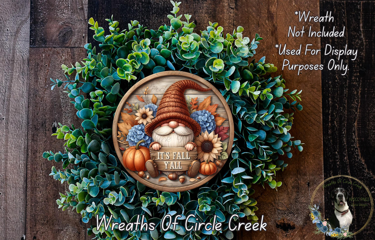 A wreath made of various fall-themed elements, including a gnome, flowers, and pumpkins, with the text "It's Fall Y'all" displayed on it.