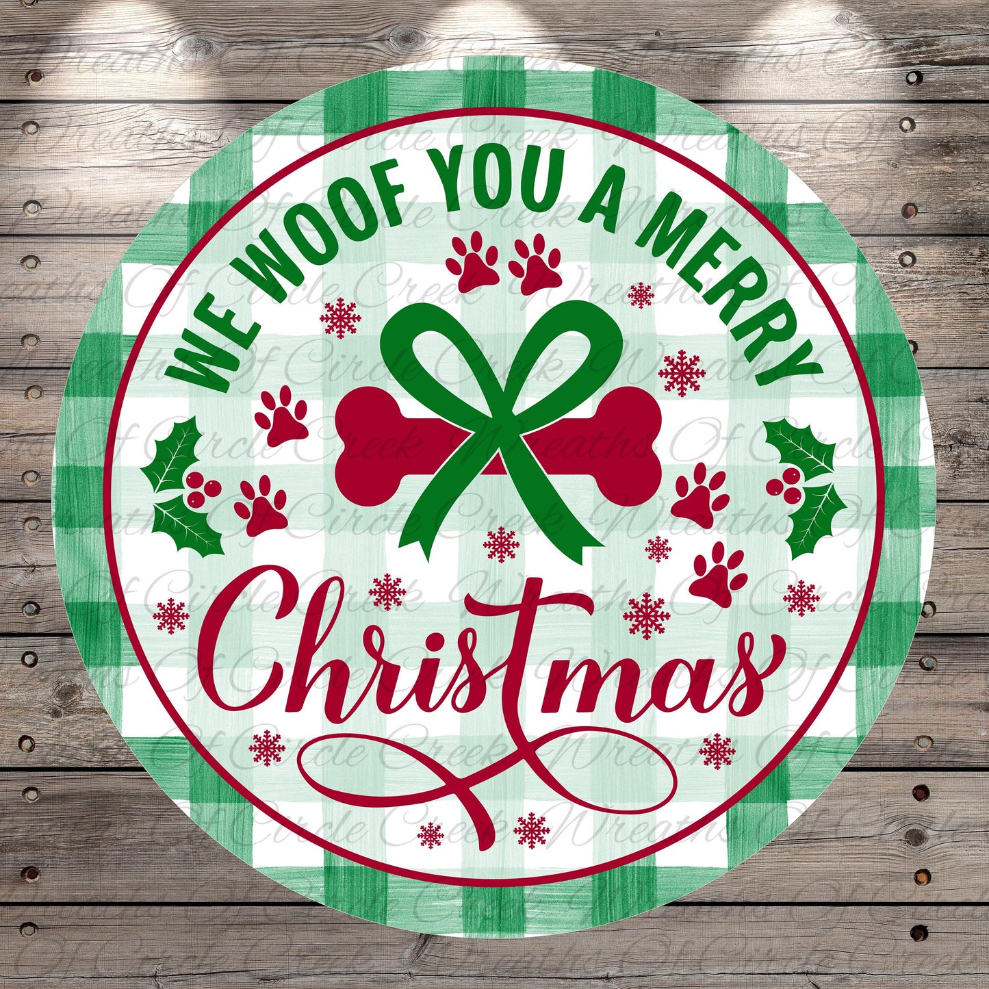 A circular Christmas-themed sign with the text "We Woof You a Merry Christmas" and various holiday-related elements such as a bow, holly leaves, and paw prints.