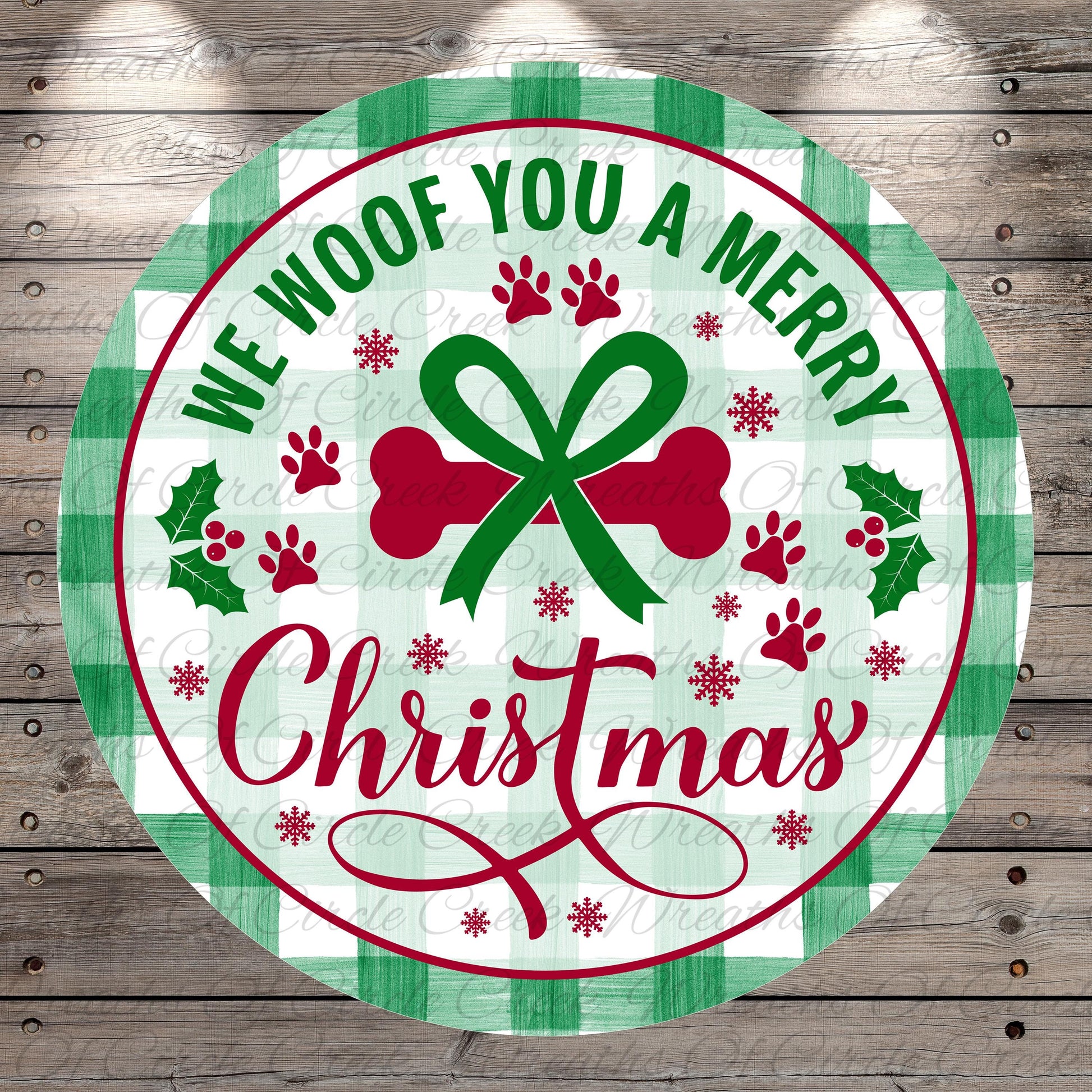 A circular Christmas-themed sign with the text "We Woof You a Merry Christmas" and various holiday-related elements such as a bow, holly leaves, and paw prints.