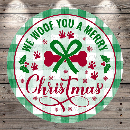 A circular Christmas-themed sign with the text "We Woof You a Merry Christmas" and various holiday-related elements such as a bow, holly leaves, and paw prints.