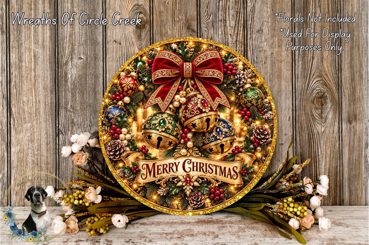A festive Christmas wreath with a red bow, bells, and a "Merry Christmas" banner, surrounded by pine cones, berries, and flowers, placed on a wooden surface.
