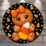 A gingerbread girl with a bow and candy cane is surrounded by candy canes on a black background with white polka dots.