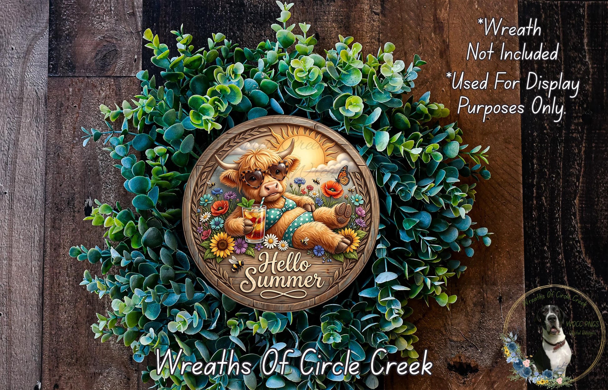 A wreath made of green leaves and flowers, featuring a cartoon cow wearing sunglasses and holding a sign that says "Hello Summer".