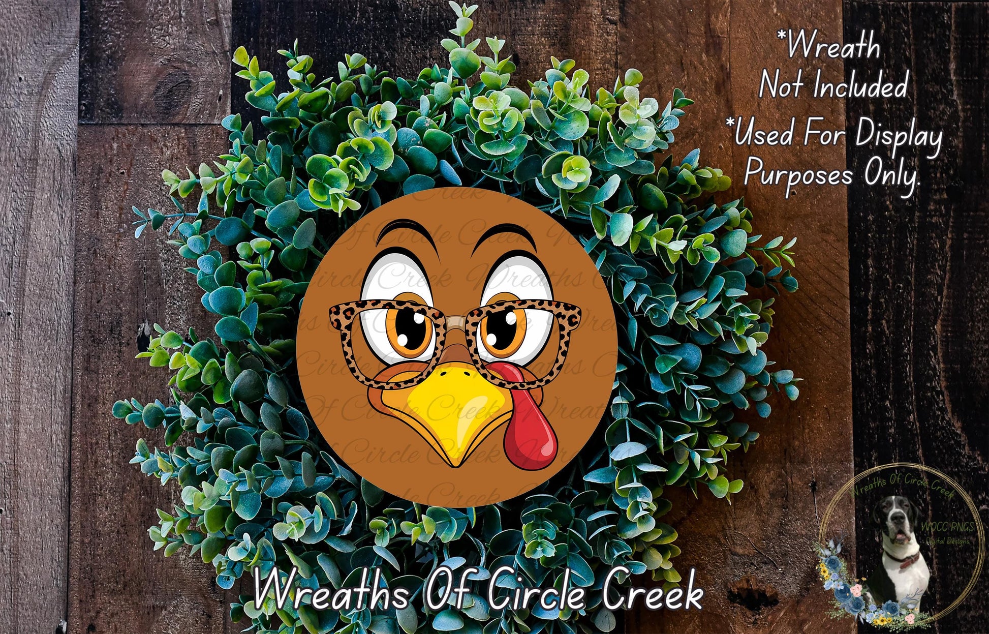 A wreath made of green plants and a cartoon turkey face with glasses, with text indicating that the wreath is not included in a display and is used for purposes only.